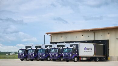 Gatik trucks backed up to loading bays
