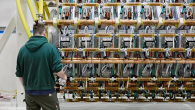 A man works on Pacific Fusion's pulser prototype.