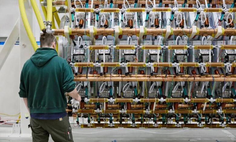 A man works on Pacific Fusion's pulser prototype.